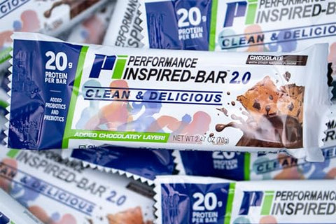 PERFORMANCE INSPIRED - Performance Inspired Nutrition – Barra de Proteína 2.0 – 20g Proteína – 6g Fibra – 4g MCTs – 1 Bilhão CFU Probióticos – 1g Prebióticos – Sem Glúten – Barra de 70g – Chocolate